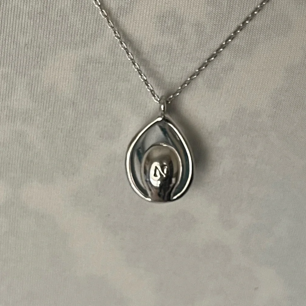 Silver Tone Teardrop Necklace with Blue Crystal & Pavé Accents